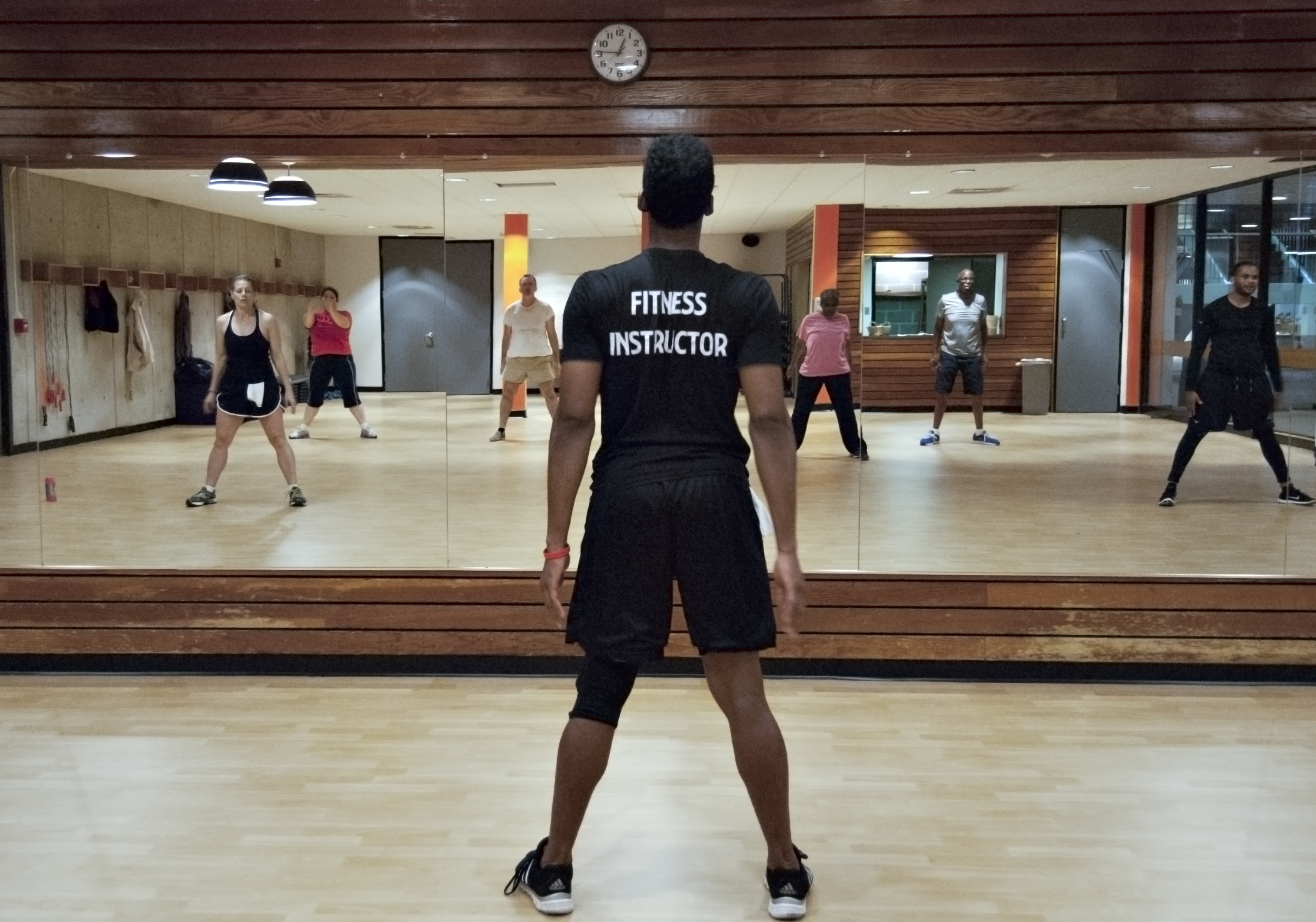 fitness instructor leading fitness class