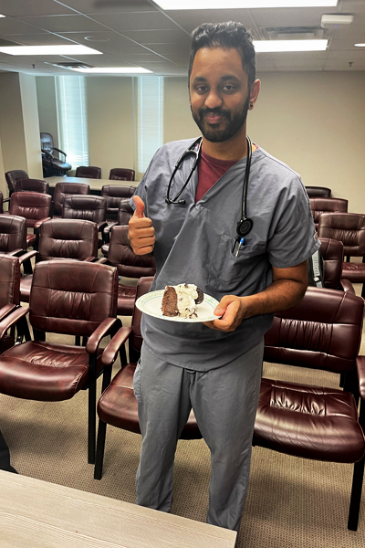 Resident holding his birthday cake