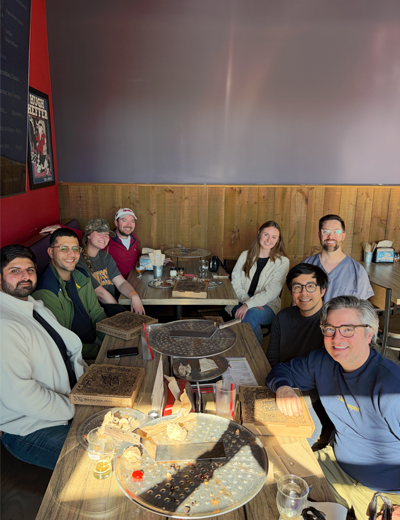 Group of residents taking a selfie at a restaurant dining table