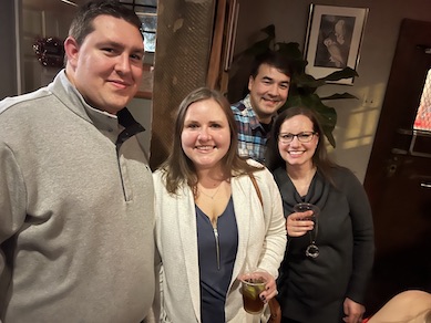 Four faculty at the holiday party