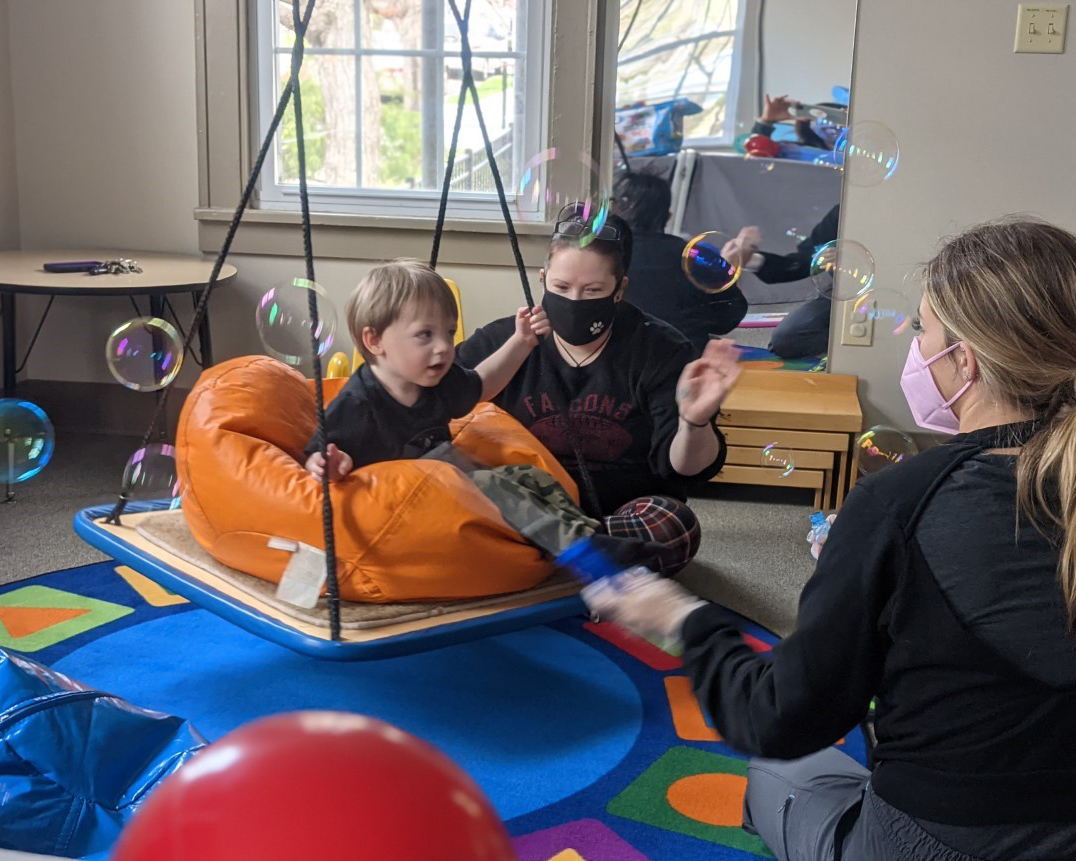 Child doing therapy with bubbles