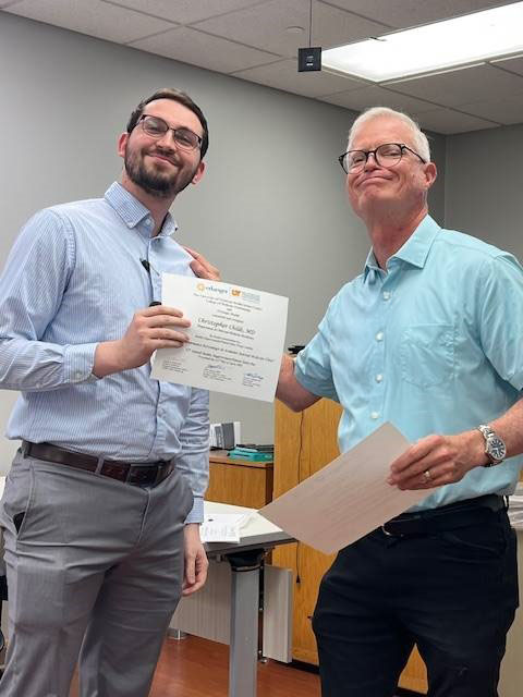 Dr. Childs receiving QIPs certificate