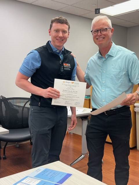 Dr. Jacobs receiving QIPs certificate 