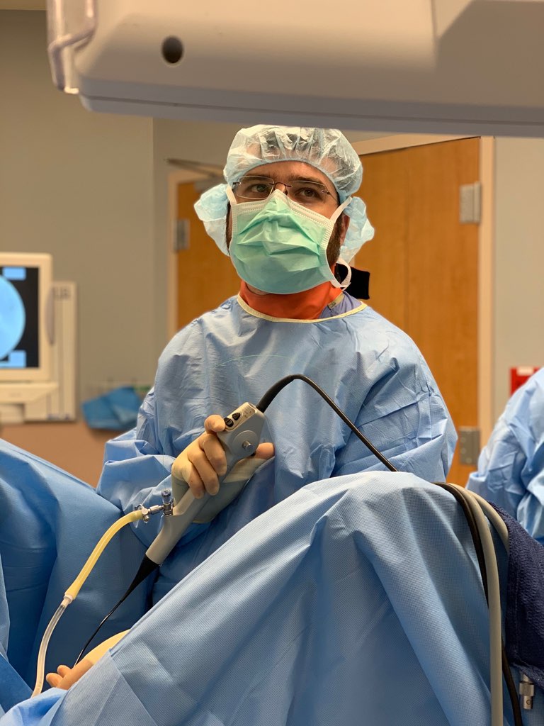 A resident working in an operating room.