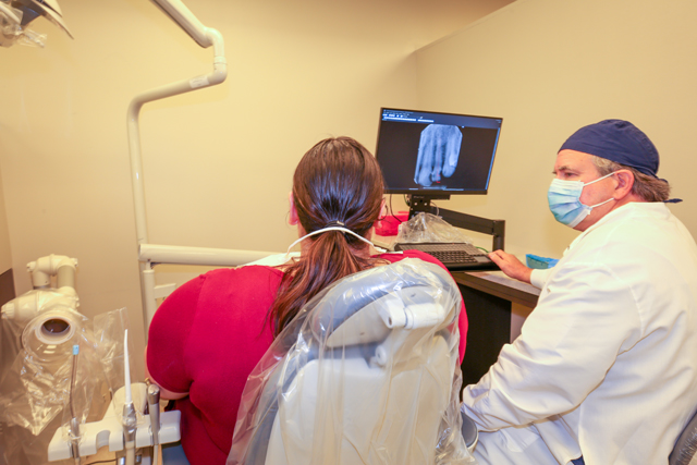 Endodonist explaining procedure to patient.