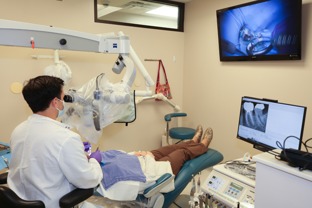 Patient being worked on in endodontics clinic.