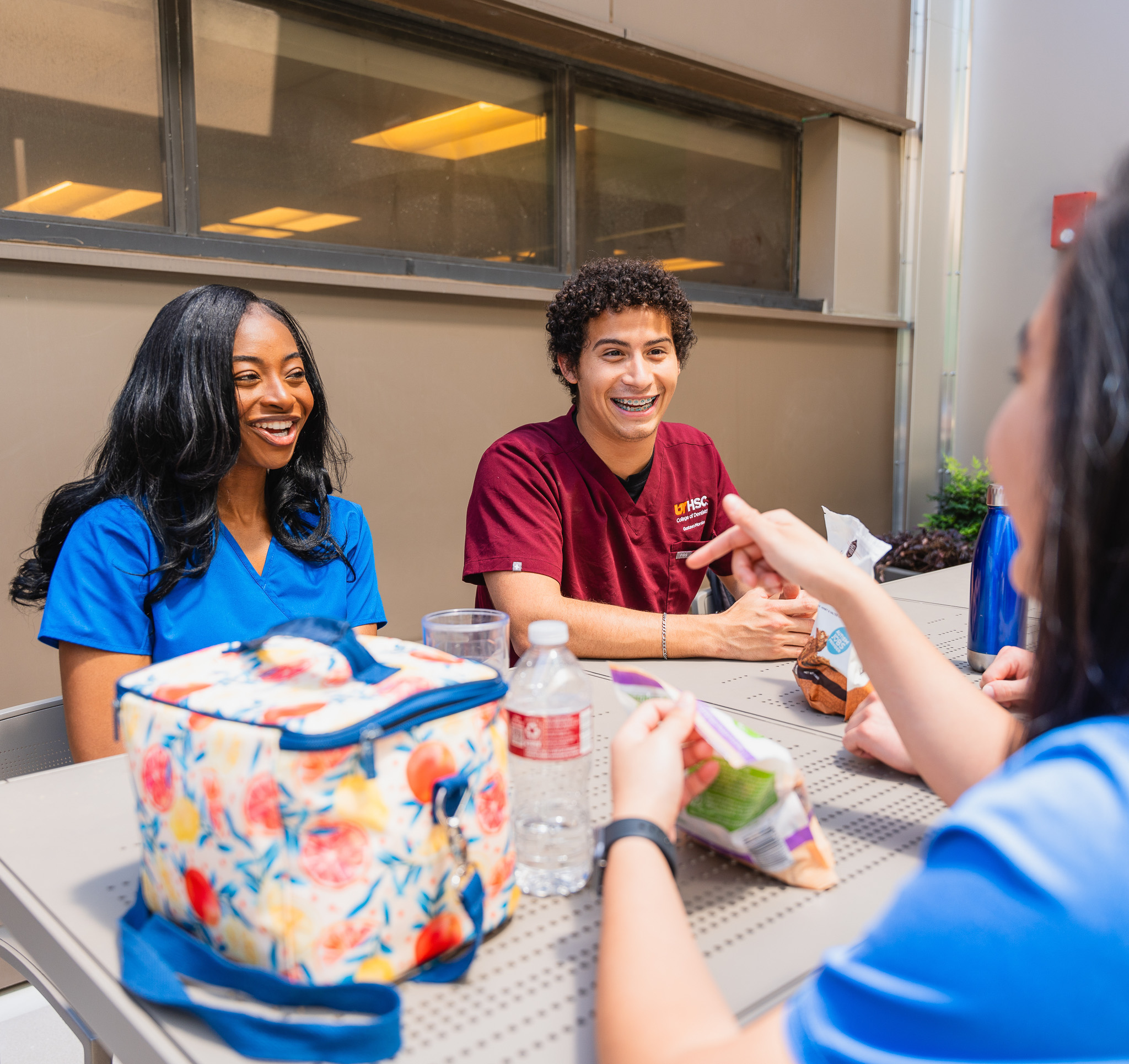 students sitting outside