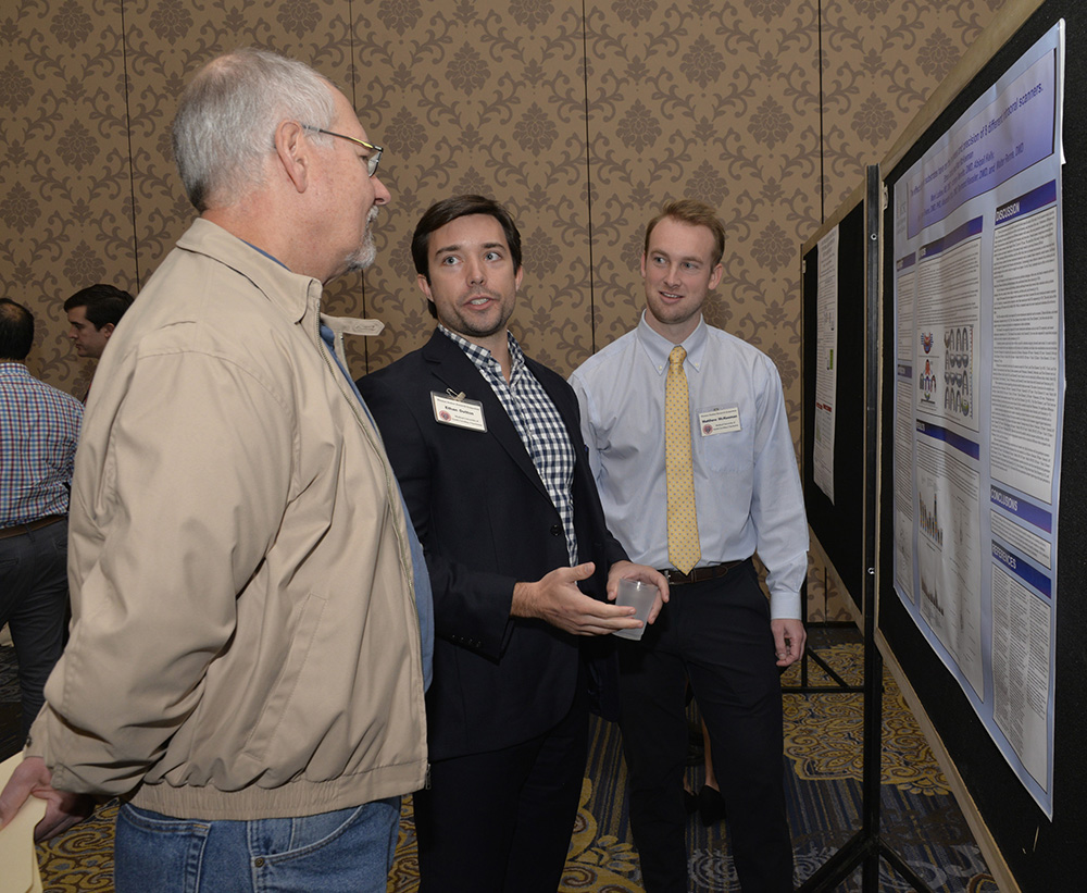 students in front of posterboard