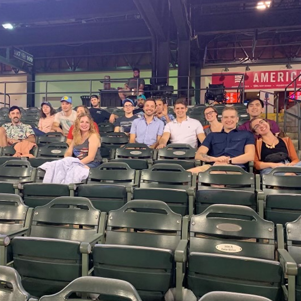 Residents sitting in an outdoor stadium