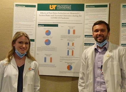 Residents before a research poster