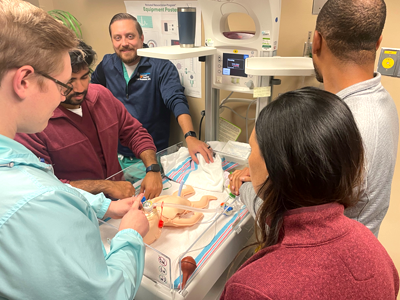 Residents working on a simulation baby