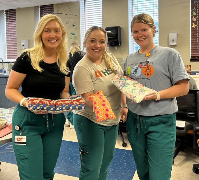 Therapists at the RKSTC with therapy pillows.