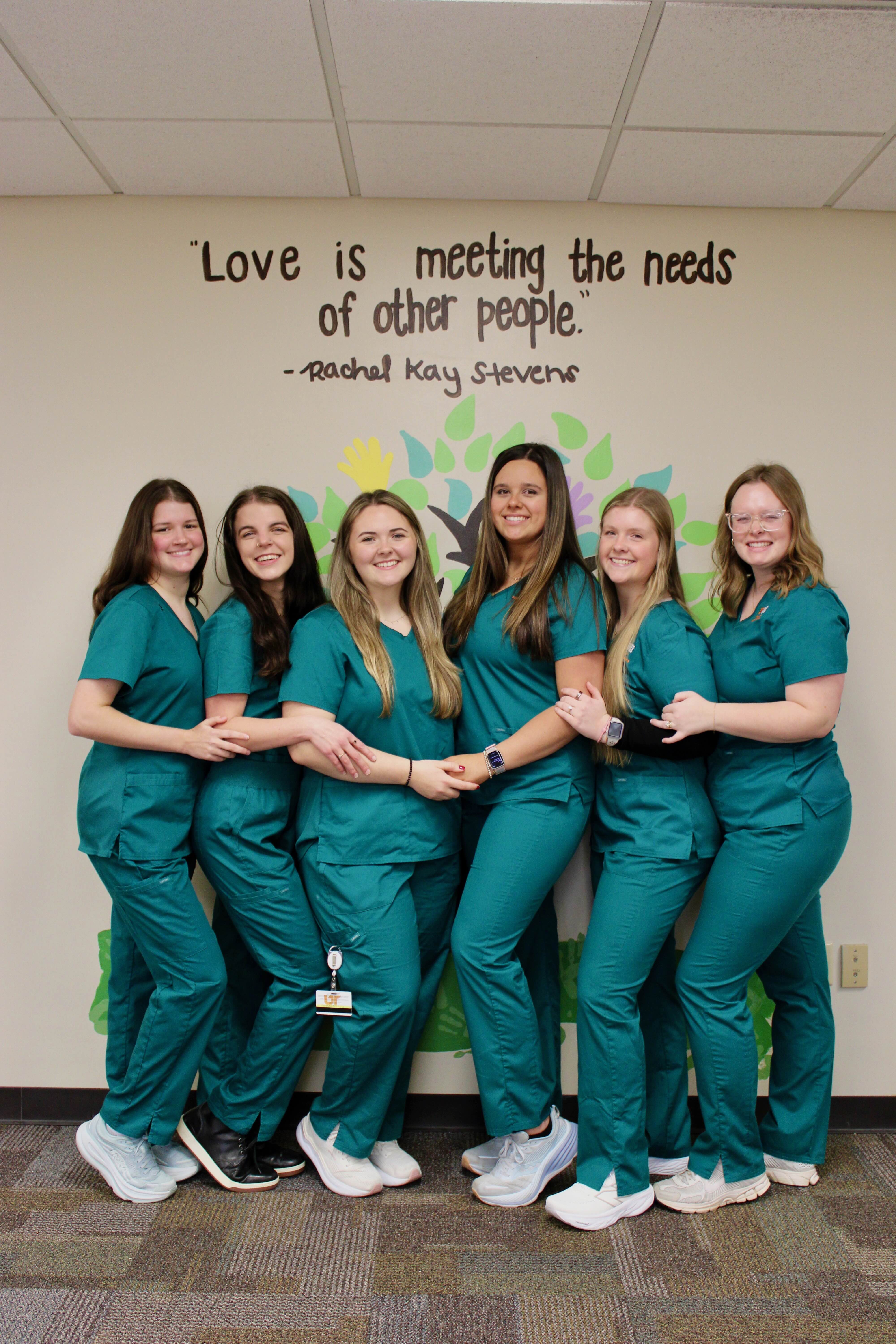 Executive Board members in a group photo. Names are listed directly below the image.