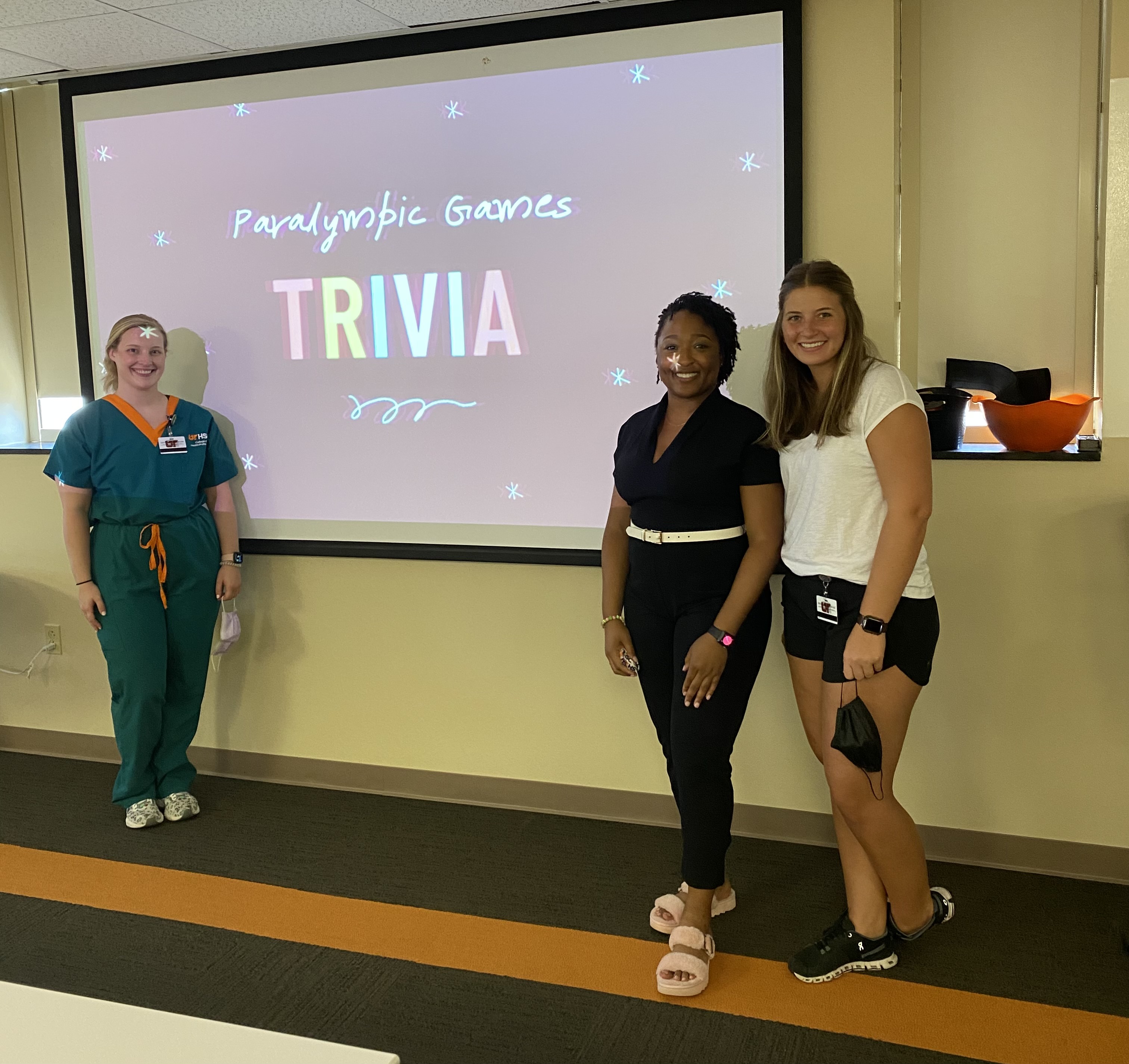 cotad members and projector screen with trivia game