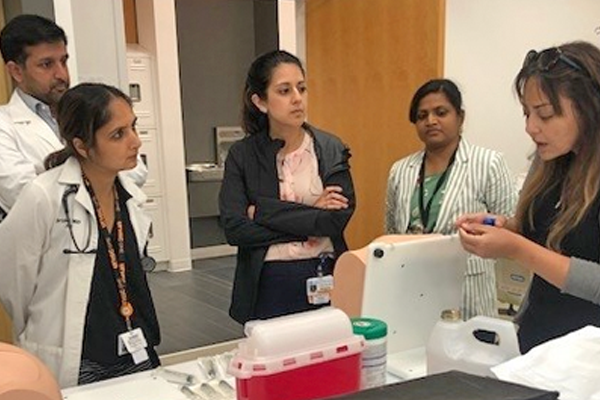 Fellows learning techniques in a lab