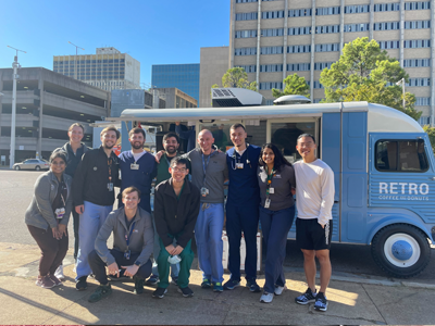 Residents in front of a truck