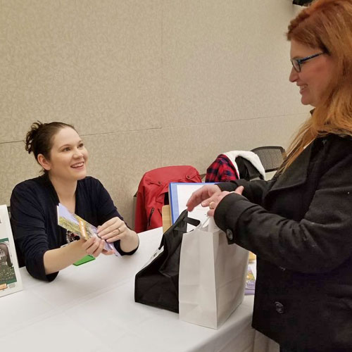 Vendor sitting at the financial aid table