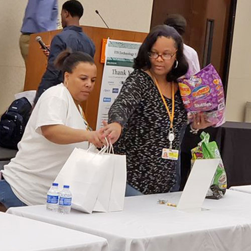 Volunteers setting up for the tech fair