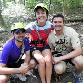 Female and two male residents in an outdoor setting