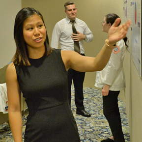 Resident in front of a research presentation