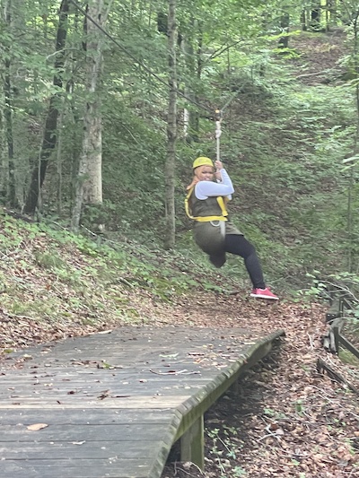 Residents swinging from tree outdoors