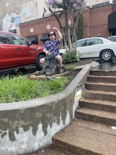 Resident riding a Sphinx statue