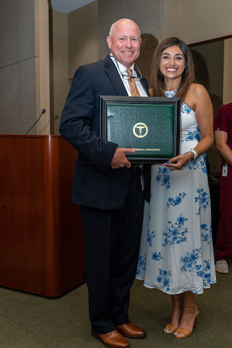 Dr. Mitchell with graduate