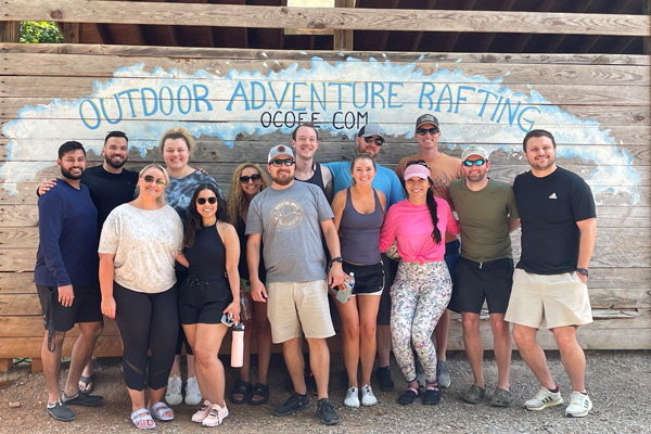 residents in front of the the ocoee sign