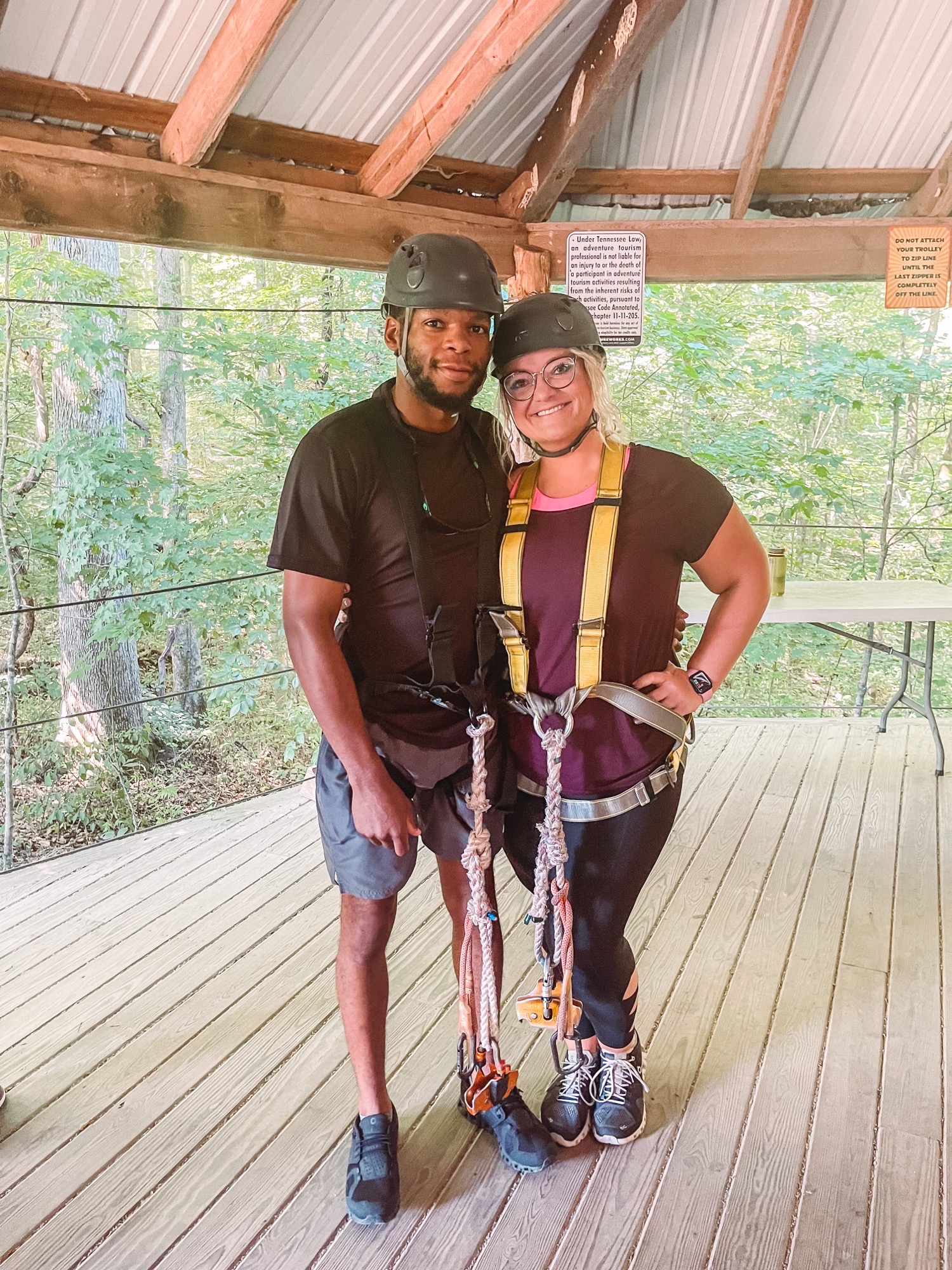 Two residents in ziplining gear