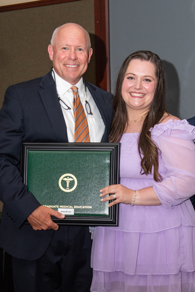 Program Director and resident with certificate