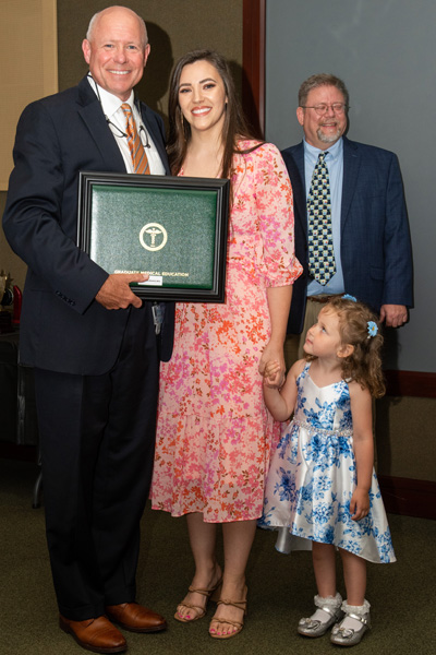 Program Director and resident with certificate