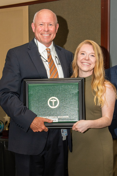 Program Director and resident with certificate