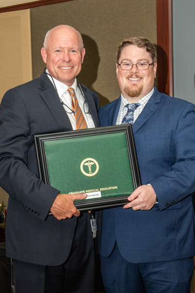 Program Director and resident with certificate