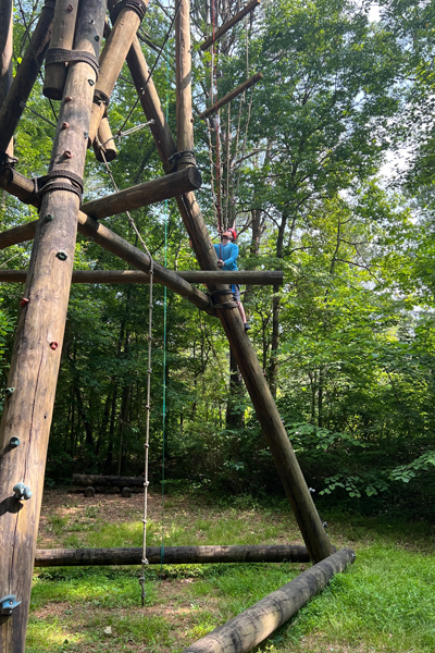 Outdoor photo of resident on the ropes course at Ocoee