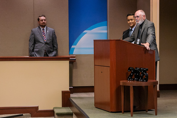 Residents and faculty on stage at graduation