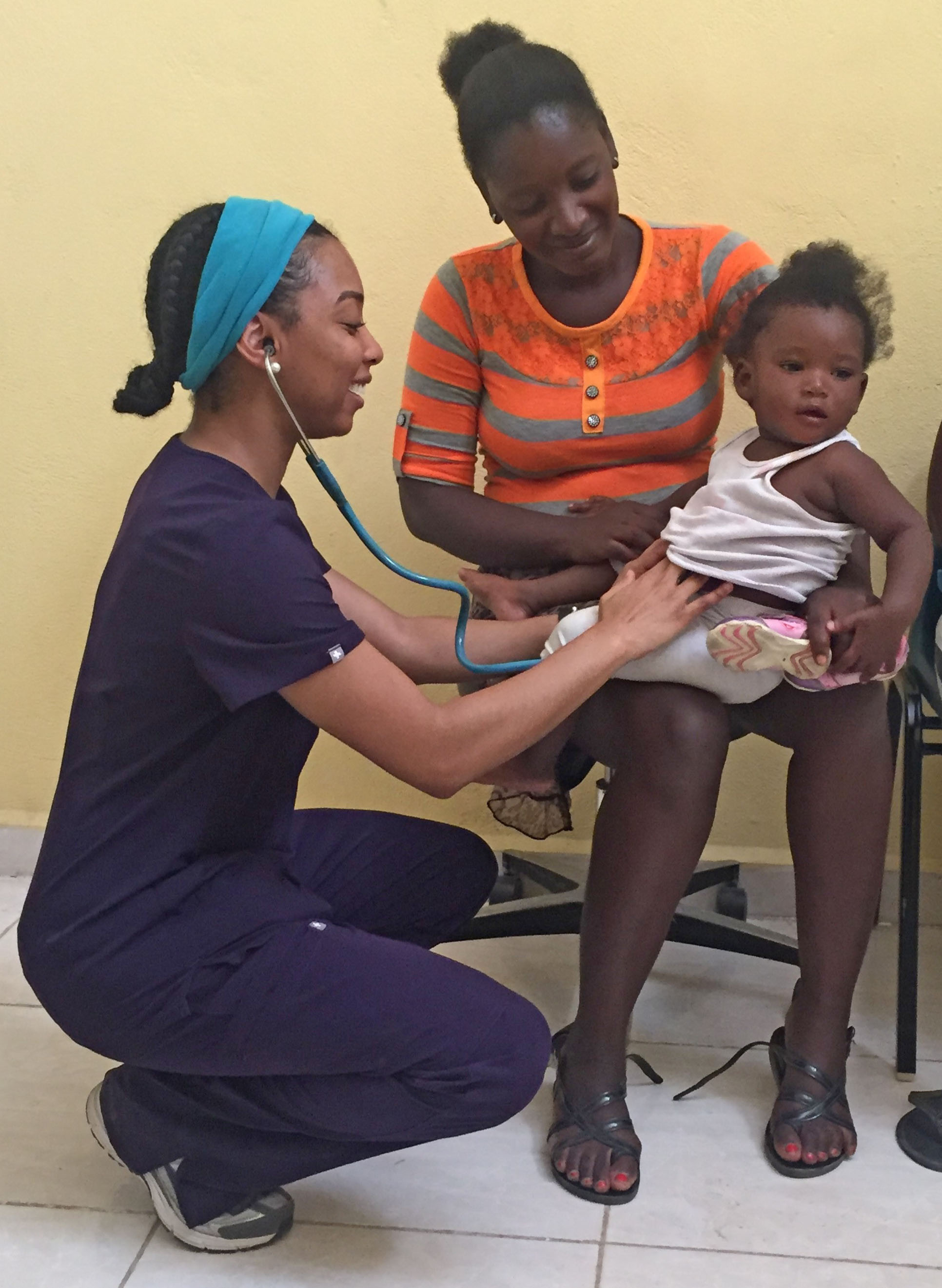 Female doctor tending to a baby