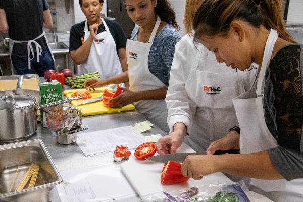 Students working in the kitchen.