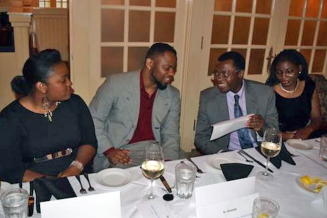 Nephrology fellows and spouses joking with each other at the 2016 graduation dinner