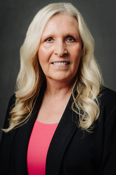 woman in pink shirt, black jacket