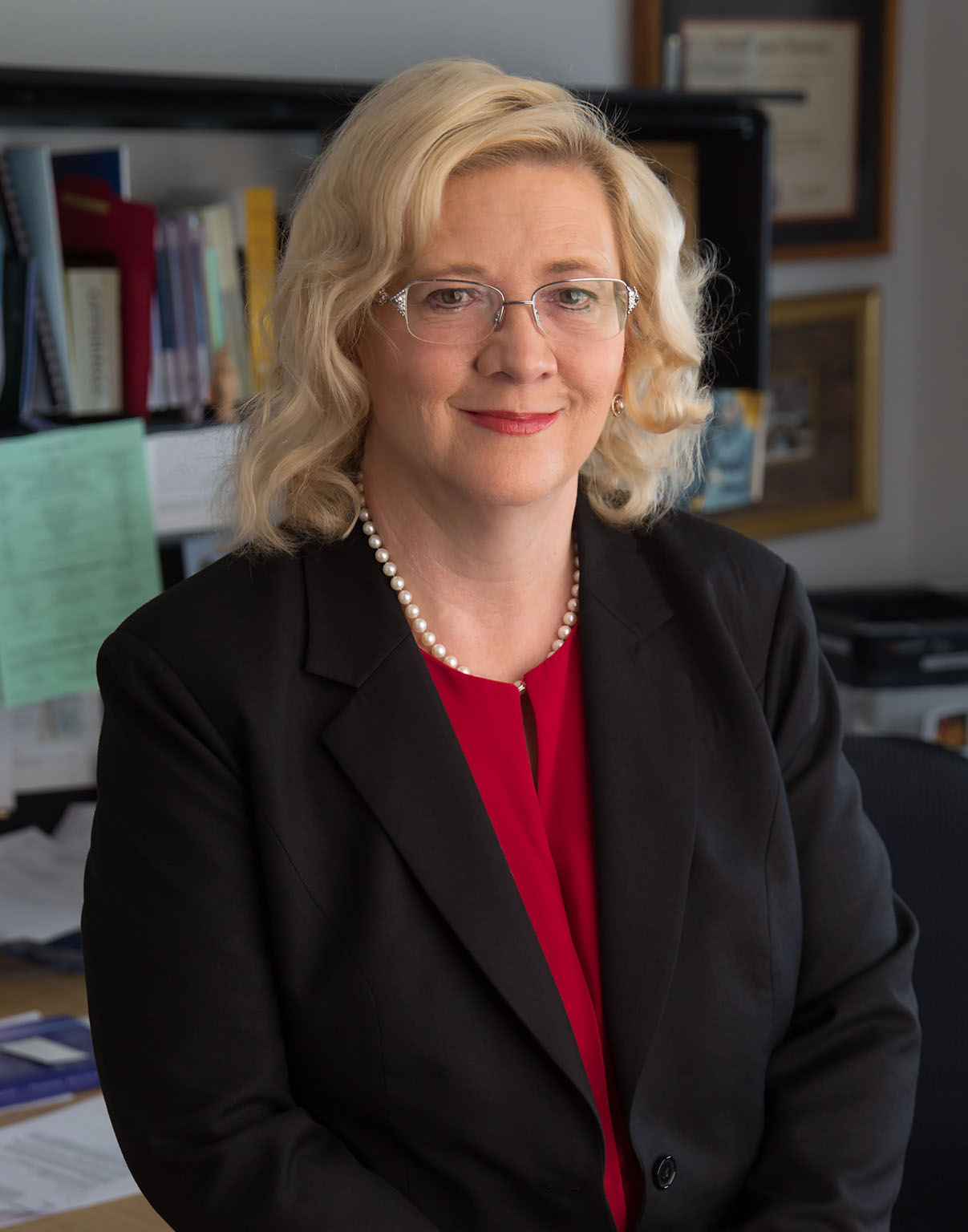 bettyferrell blonde woman in glasses wearing black blazer