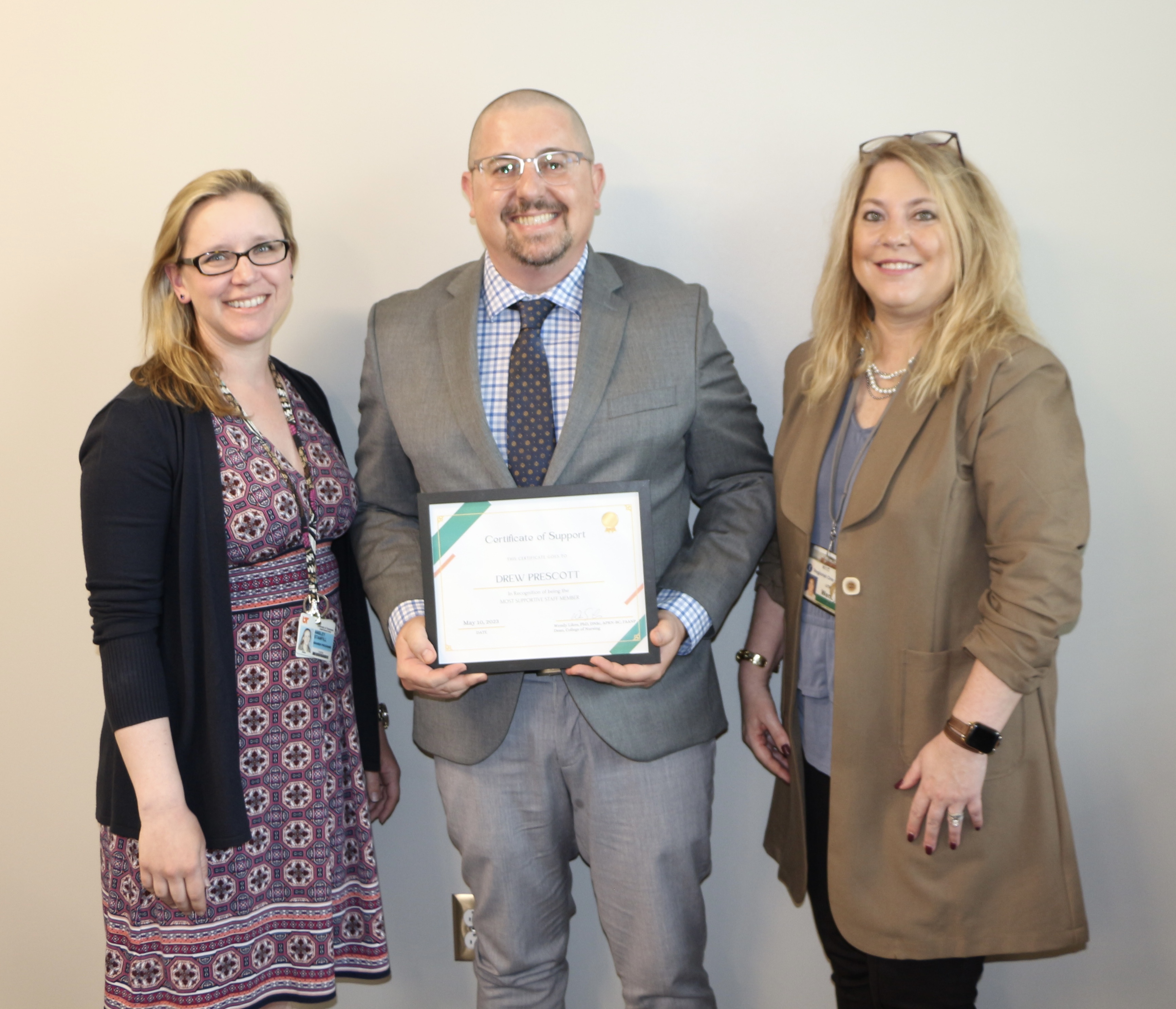 man holding certificate