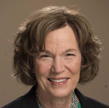 Woman with brown hair smilng