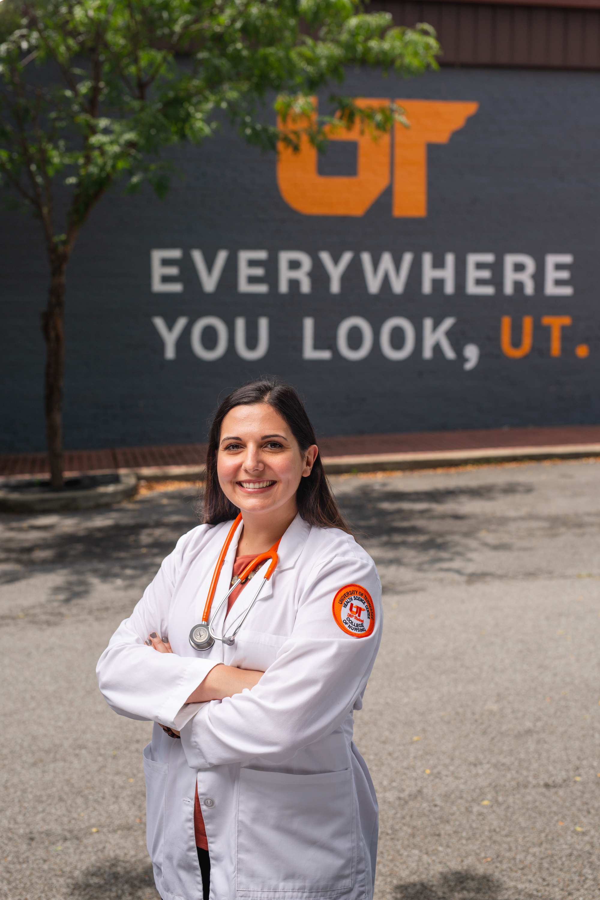 woman outside in lab coat