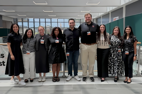 OB-GYN residents posing together in an academic health sciences building