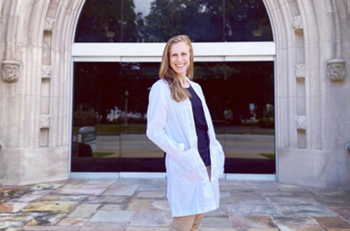 Female resident in front of UTHSC arches