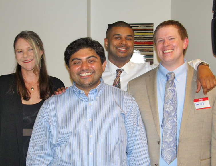 Four residents smiling for the camera