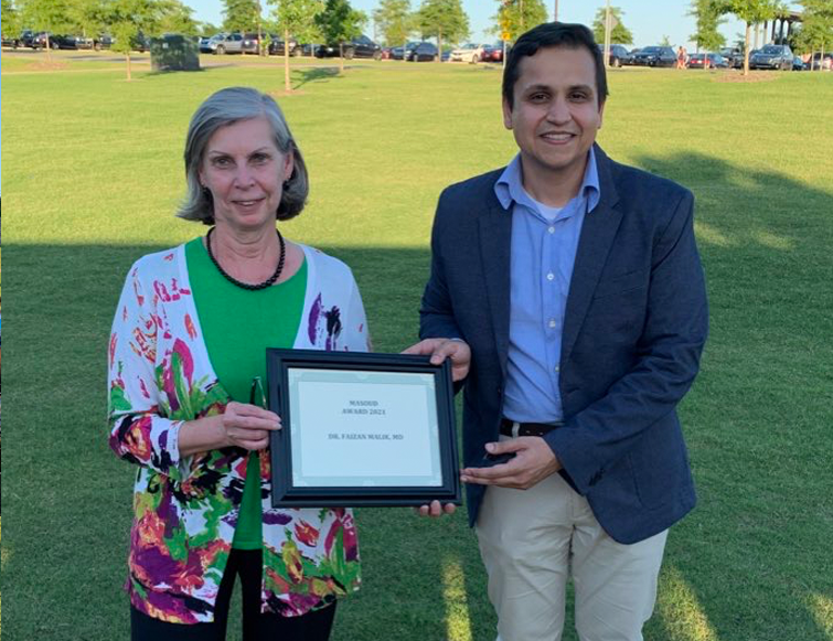 Resident receiving an award