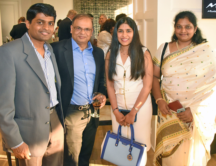 Resident, his family, and a faculty member at graduation