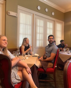 Residents sitting at a table at the 2023 graduation