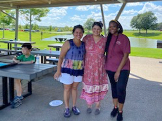 Residents standing together in an outside setting